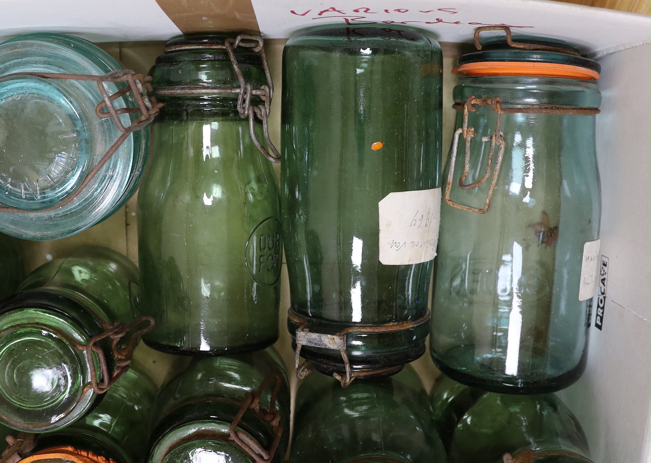 A collection of various sized French green glass storage jars (12)
